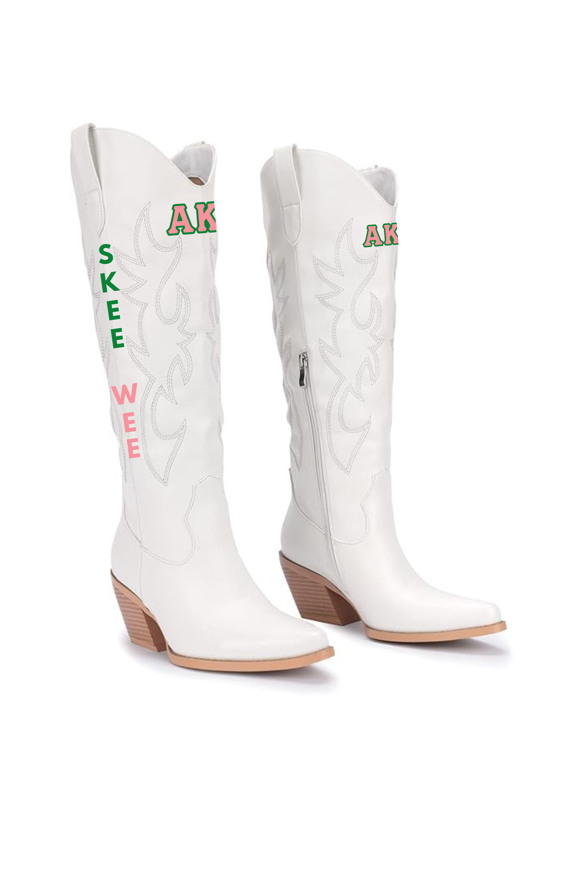 A pair of white western cowboy boots with decorative stitching, featuring 'SKEE WEE' text in green and pink on one boot and 'AKA' in green and pink on the other. Sorority Boots