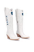 A pair of white faux leather cowboy boots featuring blue embroidered details, including a buffalo head logo and the word 'BISON' on the shaft, set against a plain white background.
