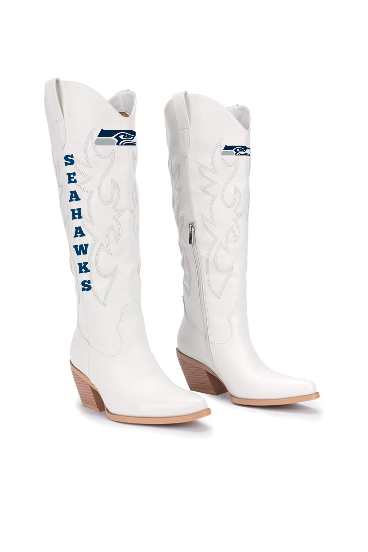 A pair of white Seattle Seahawks cowboy boots with blue and navy team logo details, shown on a clean white background.
